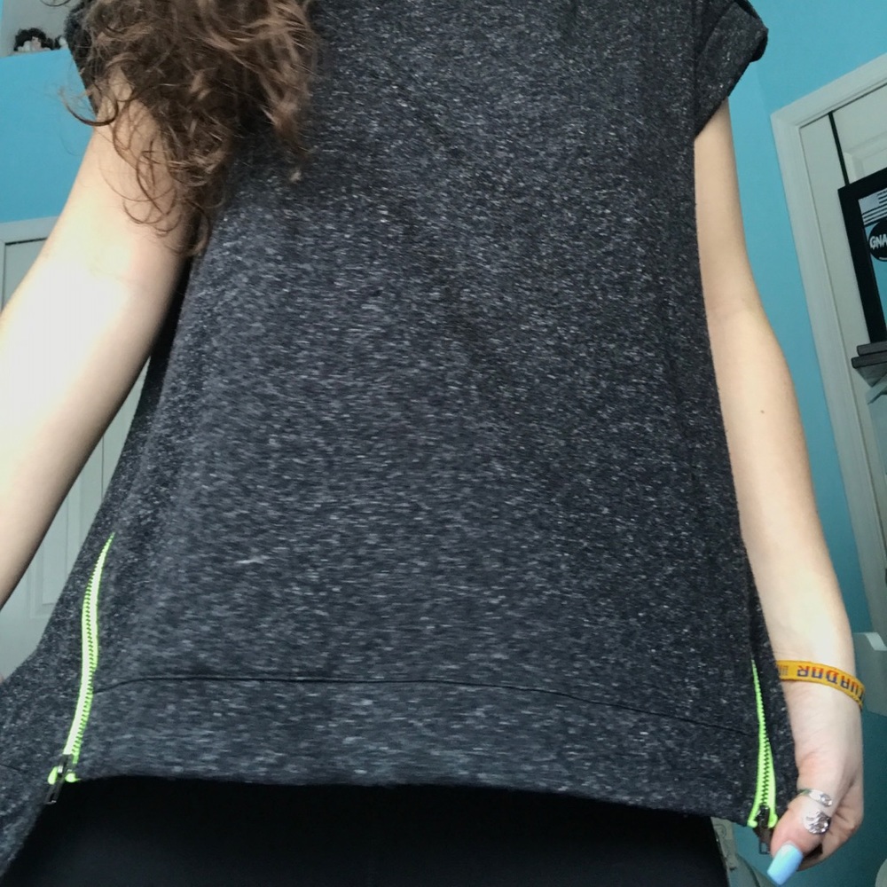 Loose grey top with green zipper detail